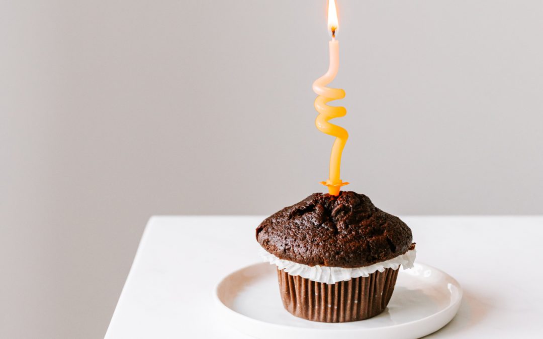 Pic showing a cupcake with a single twisty candle in the centre